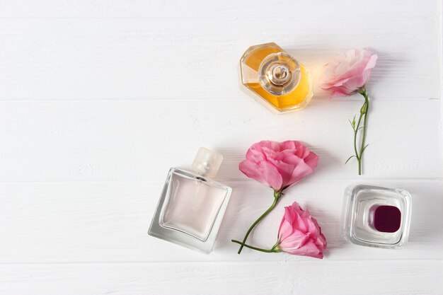 Set of different perfumes on a light background