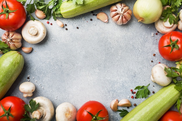 Set of different seasonal vegetables on a gray concrete background. 