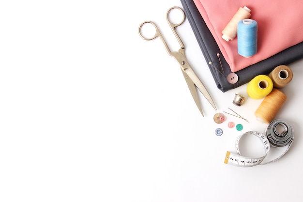 Set of different sewing accessories on a white background closeup