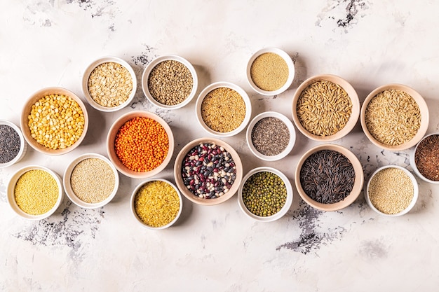 Set of different superfoods- whole grains, beans and legumes, seeds and nuts, top view.