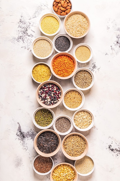 Set of different superfoods- whole grains, beans and legumes, seeds and nuts, top view.