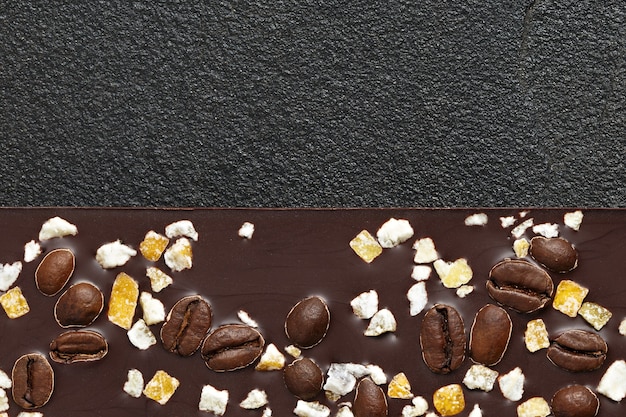 Set of different varieties of chocolate on dark stone