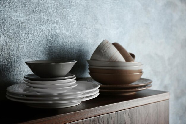 Set of dinnerware on gray background