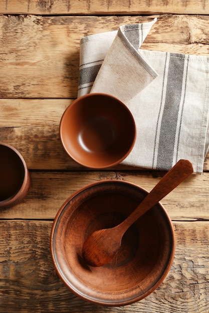 Set of dinnerware on wooden table top view