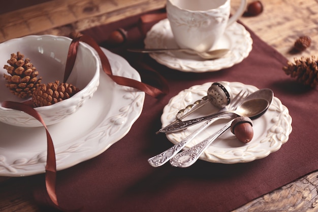 Set of dinnerware on wooden table