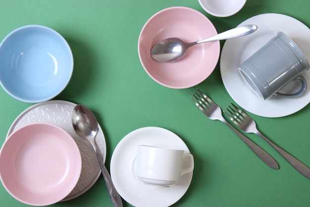 Set of dishes and kitchen utensils top view