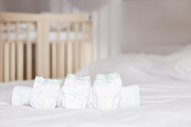 Photo set of disposable soft new baby diapers