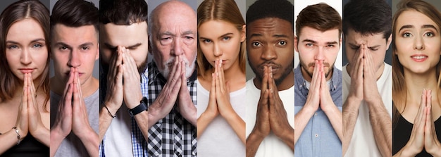 Foto insieme di persone diverse con le mani insieme in gesto di preghiera sullo sfondo dello studio