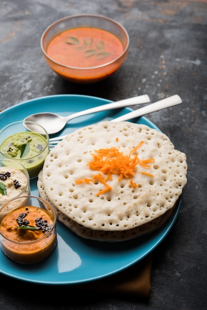 Set Dosa, Oothappam or uttapam style dosa is a popular south Indian food served with sambar and chutney, selective focus