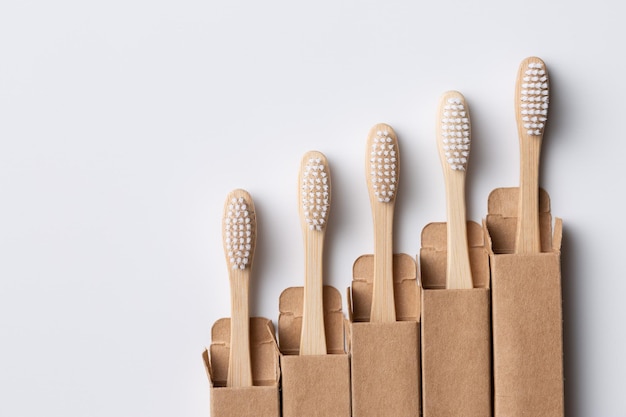 Set of ECO friendly wooden bamboo toothbrushes Save the planet or NO plastic concept Isolated on white background