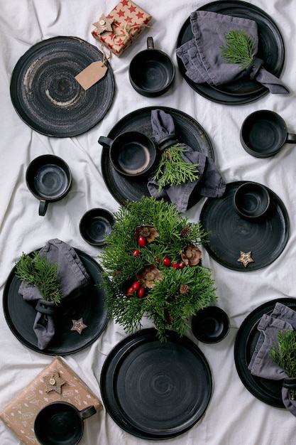 Set of empty black handcrafted ceramic plates