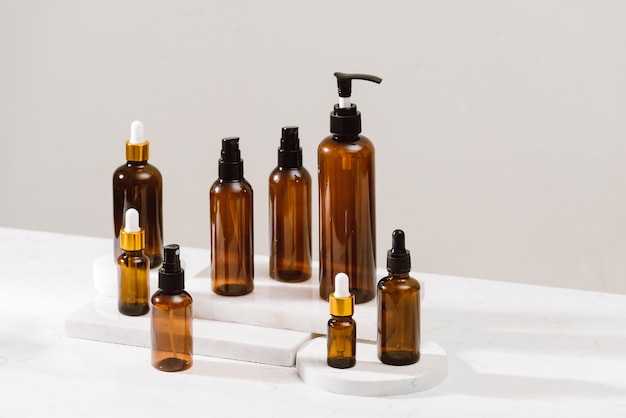 set of empty brown transparent spray bottles