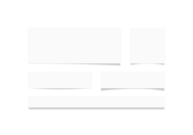 Набор пустых белых полотен разной формы с тенью на стене