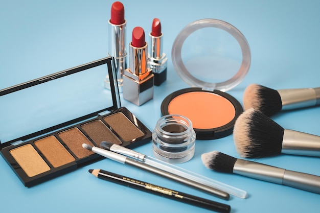 A set of female cosmetics on a blue background