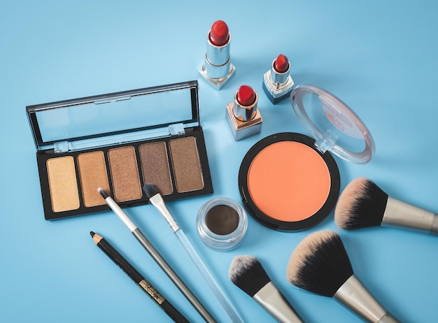 A set of female cosmetics on a blue background