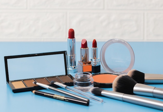 A set of female cosmetics on a blue background