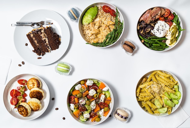 set of festive meals of meat and vegetables and sweets on white background isolated menu set