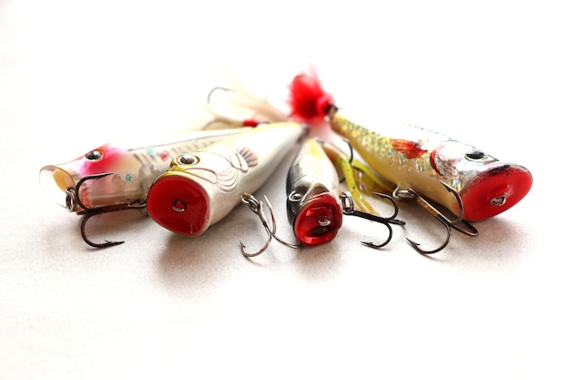 Set of fishing lures with a triple hook poppers