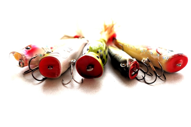 Set of fishing lures with a triple hook poppers