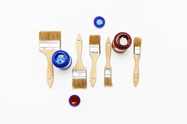 Set of five new renovation brushes with paint