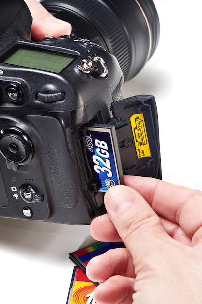 Set flash cards CF in DSLR camera closeup