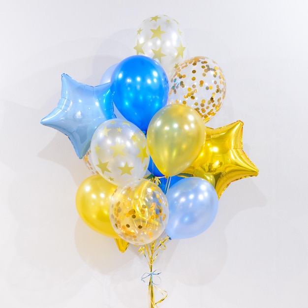 Set of foil helium balloons in form of stars Concept of holiday happy birthday