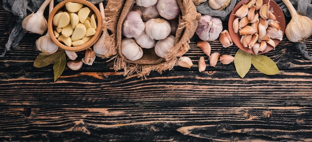 A set of fresh garlic on a wooden background Top view Copy space