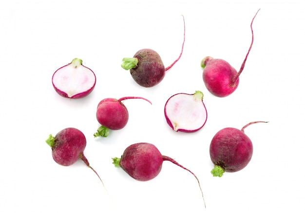 Set of fresh whole and sliced radish isolated. Top view