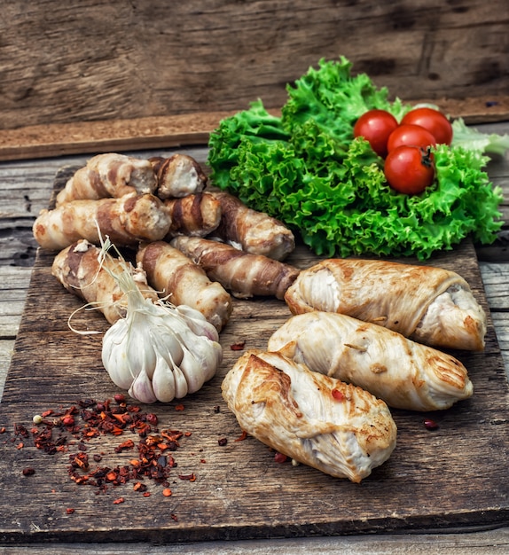 Set fried meat sausages on wooden background