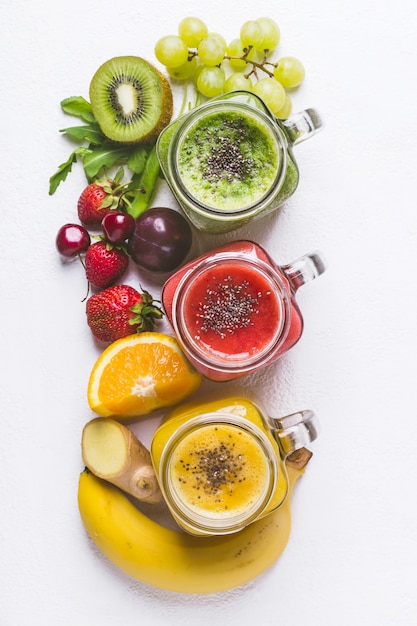 Set of fruits and berries smoothies on a white background