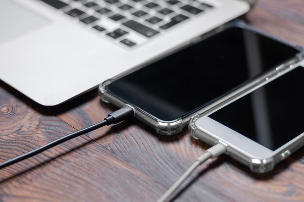 Set of gadgets. Laptop two smartphones.