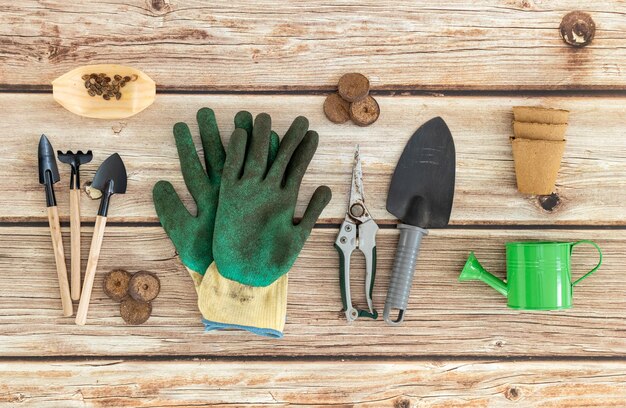 A set of gardening tools on a wooden table