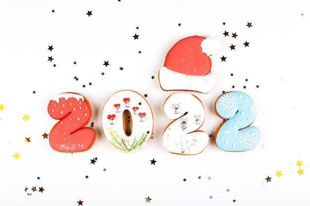 Set of gingerbread biscuits in shape of numbers of new year on white background