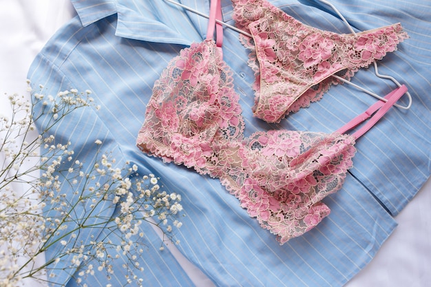 Set of glamorous stylish sexy lace lingerie with flowers and pajamas