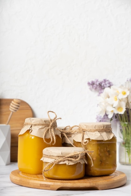 Set of glass jars with honey in the interior of the kitchen