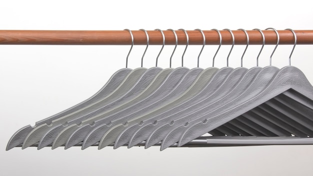 Set of gray clothes hangers on a white