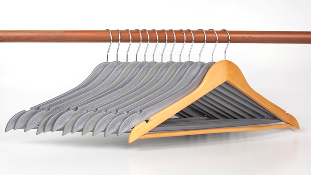 Set of gray clothes hangers on a white