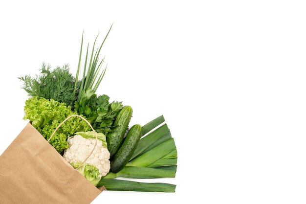 Set of green products in a paper bag Isolated on white background