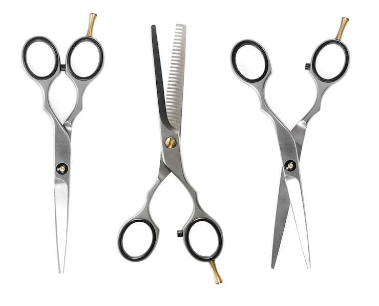 Photo set of hairdressing scissors isolated on white background