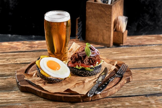 Set of hamburger with egg and beer