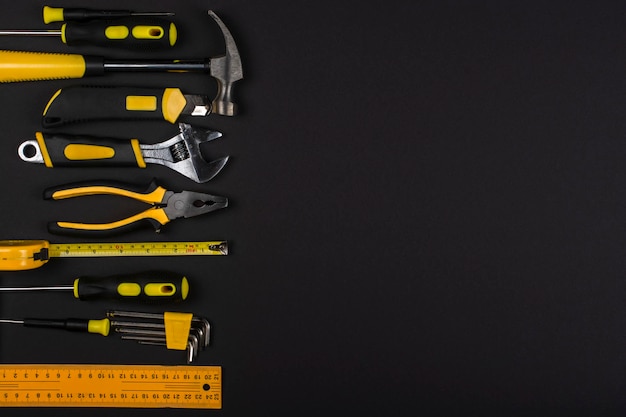 Set of hand tools on a black background. Copy space.