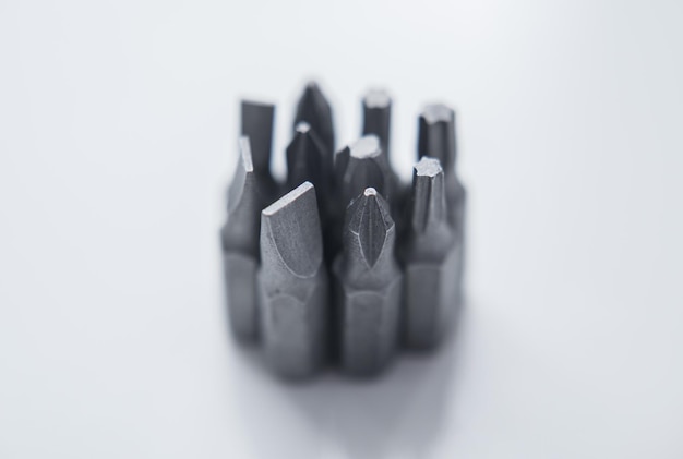 Set of heads for screwdriver bits Tools collection copy space close up selective focus blurred dark background