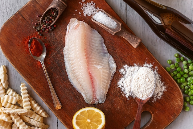 Set of ingredients for the preparation of the classic English dish fish and chips