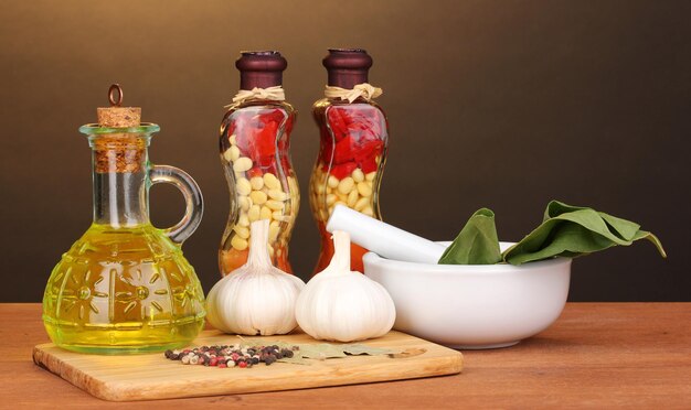 Set of ingredients and spice for cooking on wooden table on brown background