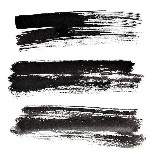 Photo set of ink black brush strokes isolated on the white background