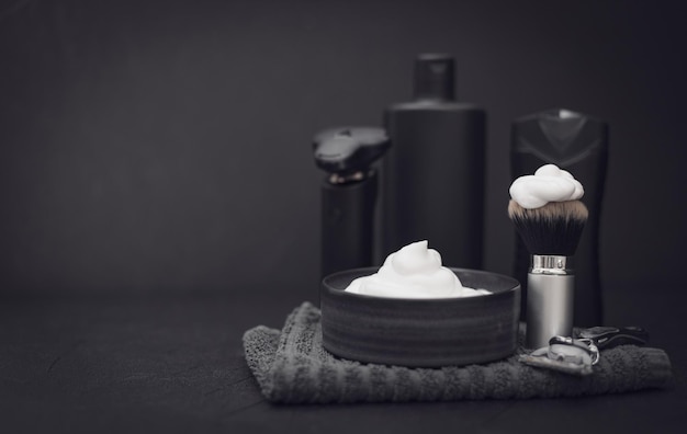 A set of items for shaving a beard on a black background