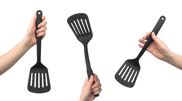 Set of kitchen spatula for cooking. Woman hand hold kitchenware isolated on a white background photo