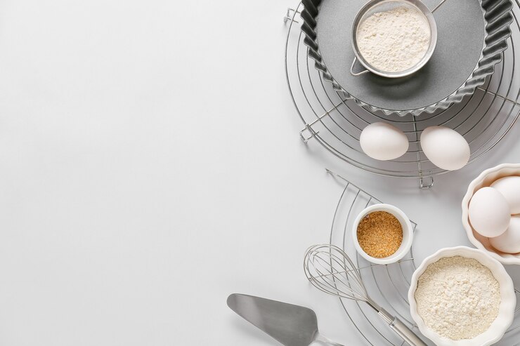 Photo set of kitchen utensils and ingredients for preparing bakery on light background