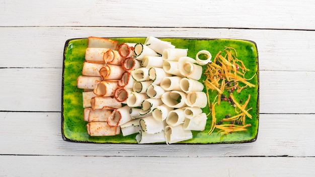 A set of lard with garlic pepper and paprika ukrainian cuisine on a wooden table top view copy space