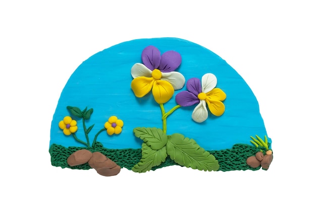 Set of large leafy leaved flowers planted in a plasticine\
garden clay flowers, green grass and rocks
